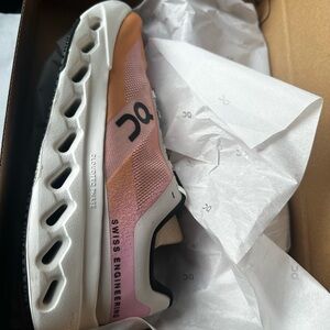 On Running Pink and Tan Sneakers